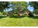 Charming brick home featuring a well-maintained lawn and mature trees at 1958 Cameron Heights Cir, Denver, NC 28037