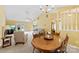 Open-concept living room with dining area, vaulted ceiling and lots of natural light at 1958 Cameron Heights Cir, Denver, NC 28037