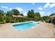 Relax and enjoy the in-ground pool surrounded by a fenced yard and beautiful landscaping at 1958 Cameron Heights Cir, Denver, NC 28037