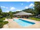 Backyard oasis featuring a sparkling pool, mature trees, and black aluminum fence at 1958 Cameron Heights Cir, Denver, NC 28037