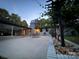 Outdoor patio boasts room for dining with landscape wall with seating area at 209 Falcon Dr, Concord, NC 28025