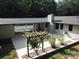 Aerial view of a large backyard featuring a patio, a covered area, and landscaping at 209 Falcon Dr, Concord, NC 28025