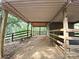 View of the barn interior featuring a dirt floor and wooden structure, perfect for rural property at 209 Falcon Dr, Concord, NC 28025