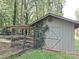 Rustic barn with wooden fence and charming ivy details offers a serene rural retreat at 209 Falcon Dr, Concord, NC 28025