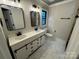 Bathroom with double sink vanity, modern fixtures, and sleek design at 209 Falcon Dr, Concord, NC 28025
