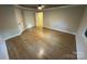 Bright bedroom featuring hardwood floors, neutral paint, and ample natural light at 209 Falcon Dr, Concord, NC 28025