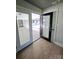 Inviting entryway with hardwood floors leading to an outdoor patio and a bright, airy living space at 209 Falcon Dr, Concord, NC 28025