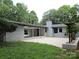 Charming brick home with a covered patio and well-manicured lawn, perfect for outdoor living at 209 Falcon Dr, Concord, NC 28025