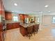 Modern kitchen boasting a large center island with a cooktop, stainless steel appliances, and ample counter space at 209 Falcon Dr, Concord, NC 28025