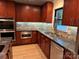 Modern kitchen with stainless steel appliances, beautiful granite countertops, and sleek cabinets at 209 Falcon Dr, Concord, NC 28025