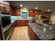 Modern kitchen with stainless steel appliances, beautiful granite countertops, and sleek cabinets at 209 Falcon Dr, Concord, NC 28025