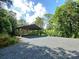 Outdoor structure featuring a gravel ground surface and a metal roof to provide shade at 209 Falcon Dr, Concord, NC 28025