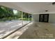 Covered patio featuring access to the backyard, providing a relaxing outdoor living space at 209 Falcon Dr, Concord, NC 28025
