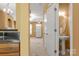 Bathroom with view into the kitchen, featuring stainless steel appliances at 212 Township Dr, Fort Mill, SC 29715
