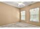 Bedroom with carpet flooring, ceiling fan and two windows at 212 Township Dr, Fort Mill, SC 29715