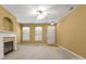 Bright living room with neutral walls, modern ceiling fan and cozy fireplace at 212 Township Dr, Fort Mill, SC 29715
