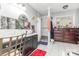 Bathroom featuring a dark vanity, granite countertop, vessel sink, and walk-in shower at 2133 Highland View Ln, Charlotte, NC 28214