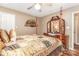 Well appointed bedroom with a wooden canopy bed, decorative fan, and matching vanity at 2133 Highland View Ln, Charlotte, NC 28214