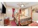 Traditional bedroom boasts a canopy bed, hardwood floors, and natural light from the window at 2133 Highland View Ln, Charlotte, NC 28214