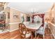 Formal dining room featuring a marble table, elegant chairs, and hardwood floors, perfect for Gathering dinners at 2133 Highland View Ln, Charlotte, NC 28214
