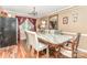 Elegant dining room with a marble table, hardwood floors, a chandelier, and ample natural light at 2133 Highland View Ln, Charlotte, NC 28214