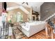 Bright living area with vaulted ceilings, a brick fireplace, and hardwood floors, perfect for entertaining at 2133 Highland View Ln, Charlotte, NC 28214