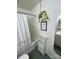 This bathroom has a bathtub/shower, and a plant hanger at 2411 Rebecca Ave, Charlotte, NC 28208
