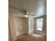 Bedroom featuring two windows, a ceiling fan, closet, and carpet flooring at 2411 Rebecca Ave, Charlotte, NC 28208