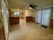 Spacious kitchen with dining area featuring tile floors, ample counter space, and natural light at 2411 Rebecca Ave, Charlotte, NC 28208