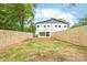 New construction home with a spacious, fenced-in backyard and a minimalist patio at 2733 Cowles Rd, Charlotte, NC 28208