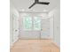 Bright bedroom with hardwood floors, neutral walls, ceiling fan and two large windows at 2733 Cowles Rd, Charlotte, NC 28208