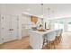 Bright kitchen features an island with barstools, modern appliances, and stylish finishes at 2733 Cowles Rd, Charlotte, NC 28208