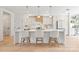 Modern kitchen featuring a center island with bar seating, modern appliances, and hardwood floors at 2733 Cowles Rd, Charlotte, NC 28208