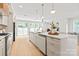 Open concept kitchen with a large center island, modern appliances, and bright lighting at 2733 Cowles Rd, Charlotte, NC 28208