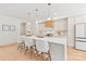 Modern kitchen featuring quartz countertops, a center island with seating, and stainless steel appliances at 2733 Cowles Rd, Charlotte, NC 28208