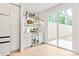 Stylish wet bar featuring modern fixtures, shelving, a beverage cooler, and hardwood floors at 2733 Cowles Rd, Charlotte, NC 28208