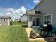 Cozy backyard with patio, grill, and shed, framed by a well-maintained lawn and privacy fence at 2810 Shumard Dr, Gastonia, NC 28054