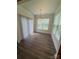 Bright dining room boasts wood floors and large windows, offering a simple and inviting space for meals at 2810 Shumard Dr, Gastonia, NC 28054