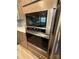 Stainless steel microwave and oven are inset with taupe cabinets and white countertops at 2810 Shumard Dr, Gastonia, NC 28054