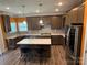 Modern kitchen featuring granite countertops, stainless steel appliances, and abundant cabinet space for cooking and storage at 2810 Shumard Dr, Gastonia, NC 28054