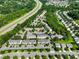 Aerial view showcasing the property's proximity to major highways, surrounding trees, and residential areas at 3414 Broadwick St, Charlotte, NC 28213