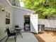 Back patio area with table, chairs, air conditioning unit, storage and privacy fence at 3414 Broadwick St, Charlotte, NC 28213