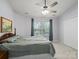 Calm bedroom featuring a comfortable bed, large window, ceiling fan, and closet at 3414 Broadwick St, Charlotte, NC 28213