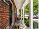 Covered porch with chairs, brick accents, and a welcoming entrance at 3414 Broadwick St, Charlotte, NC 28213