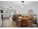 Open living area with wood floors, dining set, and comfortable seating at 3414 Broadwick St, Charlotte, NC 28213