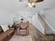 Open-concept living space showcasing the dining area, staircase, and cozy seating arrangement at 3414 Broadwick St, Charlotte, NC 28213