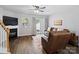 Inviting living room featuring a fireplace, sliding glass doors to the backyard, and comfortable leather seating at 3414 Broadwick St, Charlotte, NC 28213