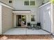 Exterior patio featuring a sliding glass door, an exterior door, and a dining set with concrete patio at 3414 Broadwick St, Charlotte, NC 28213