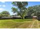 Spacious backyard with lush green lawn and mature trees, offering ample privacy at 3701 Table Rock Rd, Charlotte, NC 28226
