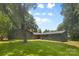 Picturesque backyard featuring a green lawn and the rear exterior of the house at 3701 Table Rock Rd, Charlotte, NC 28226